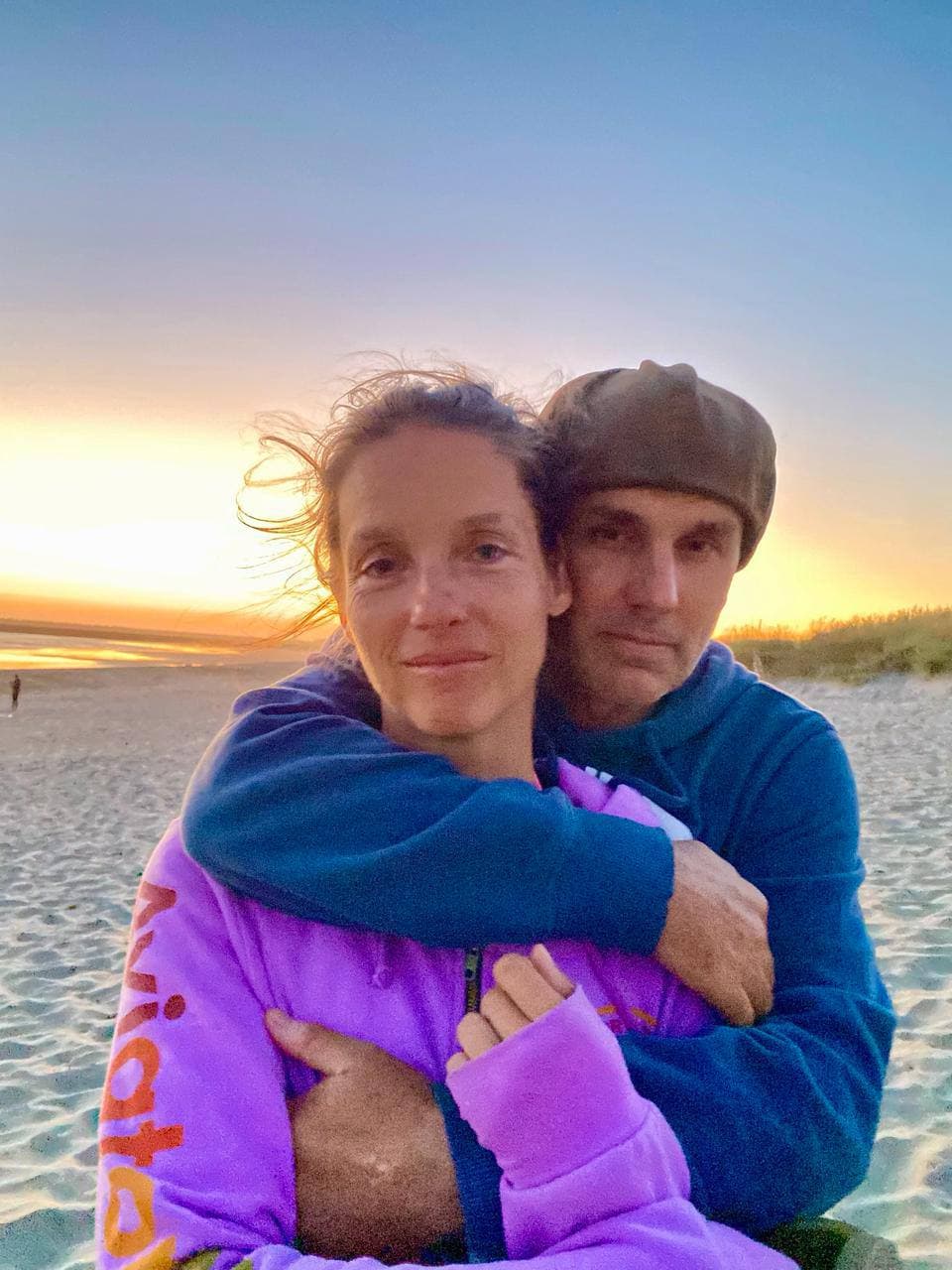 Stephanie and Marcus on the beach at sunset