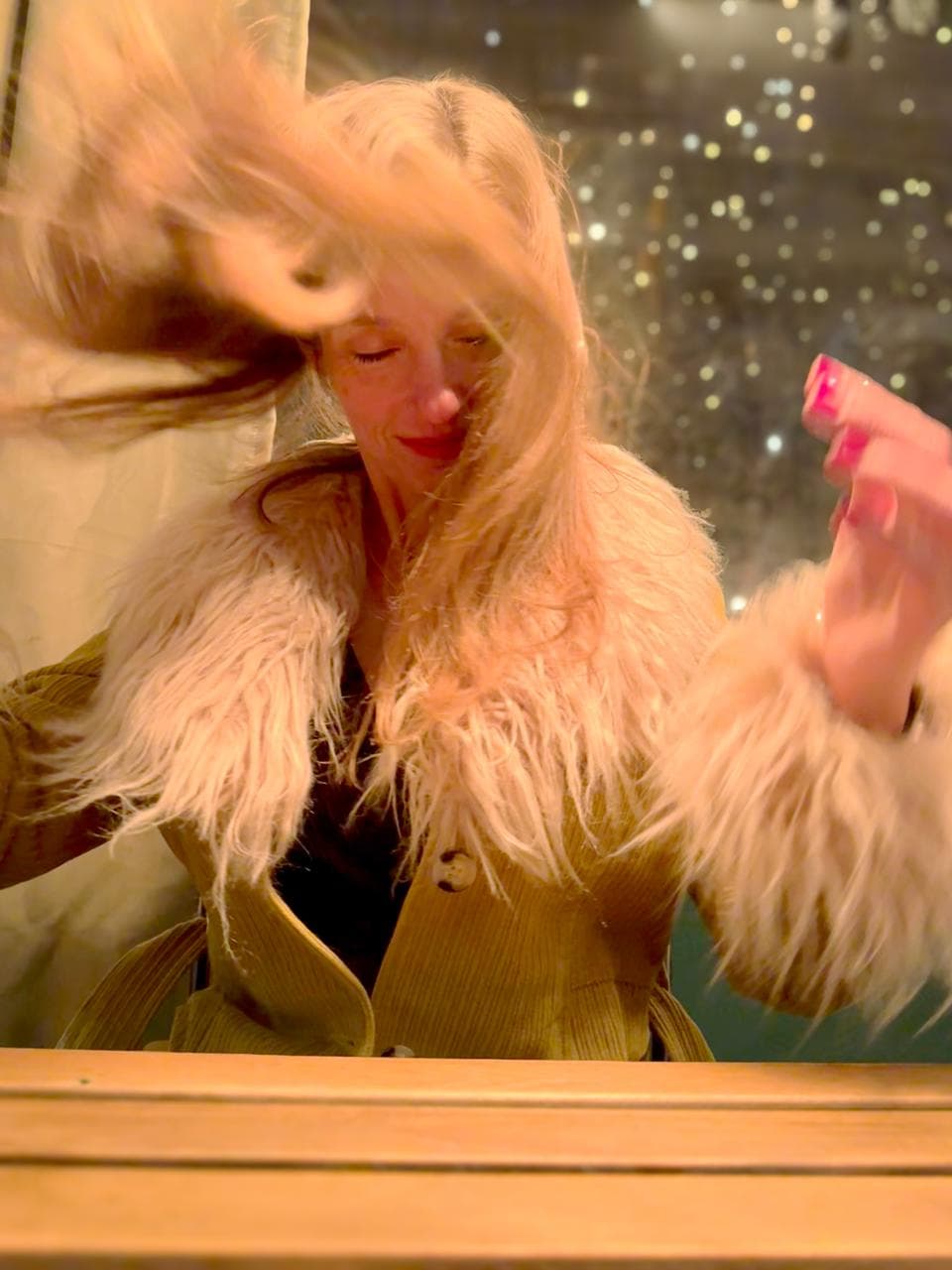 Stephanie in fur coat, hair flip