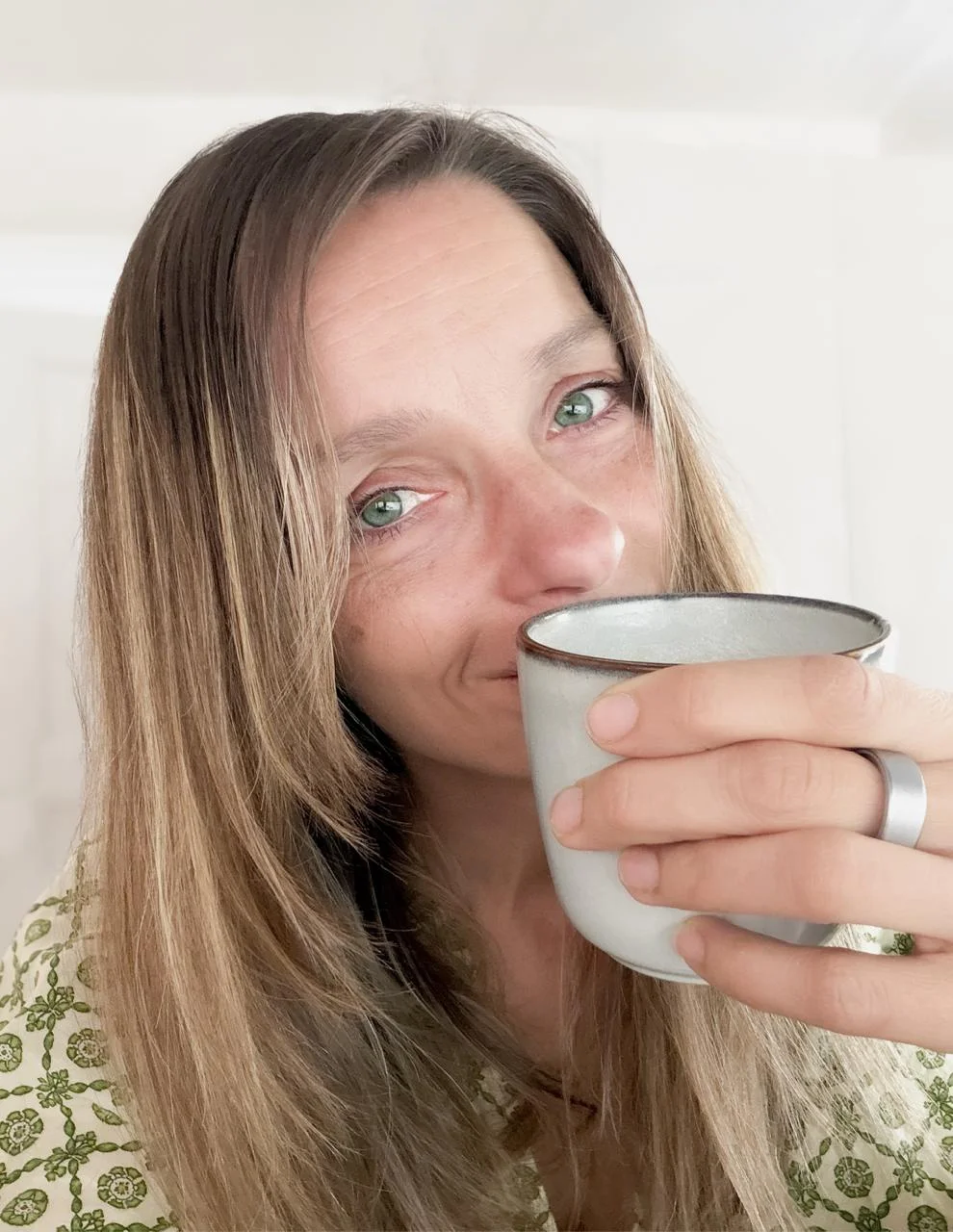 Stephanie sipping coffee